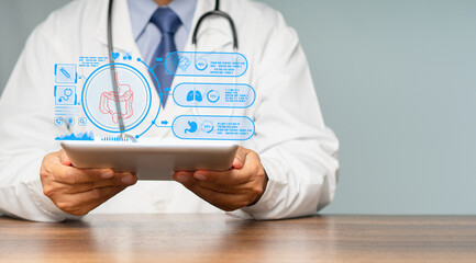 Doctor in a white coat read a report on an intestine patient checkup on a virtual screen while sitting at the table in the hospital