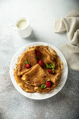 Traditional homemade crepes with raspberry