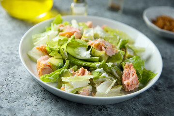 Leaf salad with hot smoked salmon