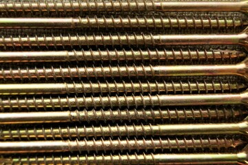 Close-up of long screws. Screws for the construction of wooden structures.