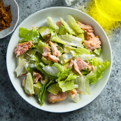 Leaf salad with hot smoked salmon