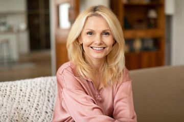 Portrait Of Blonde European Mature Woman Posing Smiling At Home