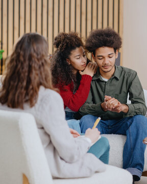 couple of man and woman at psychologist, taking care of mental health in relationship. joint therapy for solving communication problems in family. moral support for young African Americans married