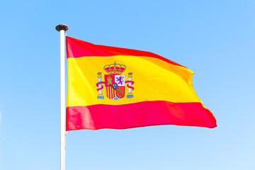 Spanish flag on a pole, undulating in the wind