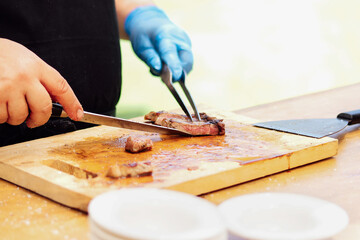 Man professional chef cooking meal outdoor