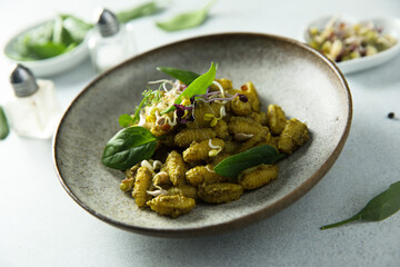 Homemade pasta with spinach pesto