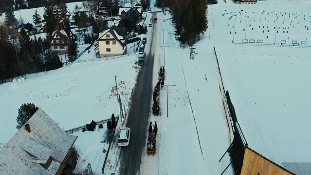 Touristic Drone Aerial View of Horse Sleigh Ride in Winter Snow Polish Mountains