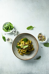 Homemade pasta with spinach pesto