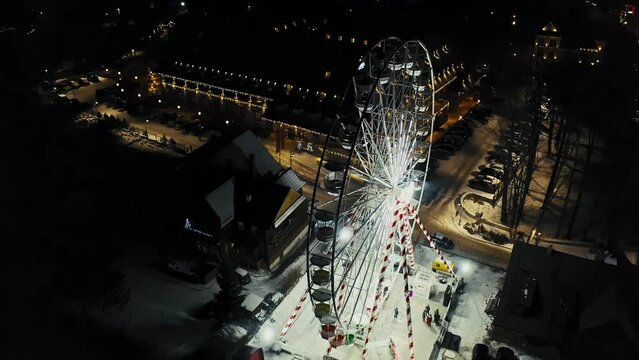 4K Aerial Drone Ferris Wheel in Winter Snow Fun