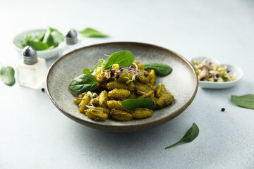 Homemade pasta with spinach pesto