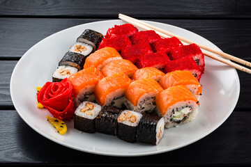 Assorted Japanese sushi roll set with salmon, tuna, shrimp, avocado, Philadelphia cheese and cucumber.