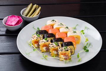Set of sushi rolls from salad Olivier and mushroom salad with chicken ham, salmon, boiled potatoes, carrots, green peas, cucumbers and eggs.