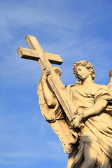Naklejka premium Ponte Sant'Angelo Bridge Statue of an Angel Holding the Cross Detail in Rome, Italy