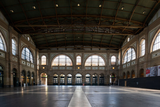 Zurich city central train station entrance hall on 05-04-2023. Wide-angle view of large hall with a clock on the wall.