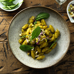 Homemade pasta with spinach pesto