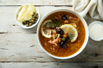 Traditional homemade soup with sausage and capers