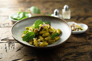 Homemade pasta with spinach pesto