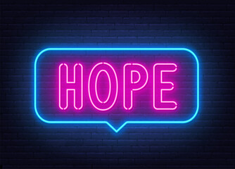 Hope neon sign in the speech bubble on brick wall background.