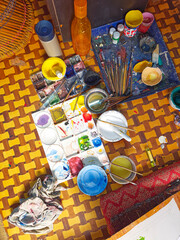 View from above of a palette of colors of an artist