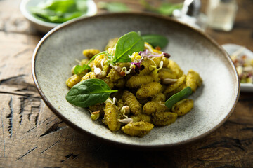 Homemade pasta with spinach pesto