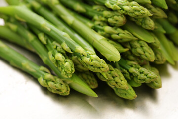 Green asparagus shots, blanched or cooked, healthy spring vegetable, selected focus
