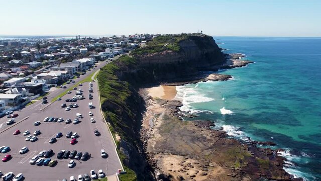 Aerial drone coastline landscape shot of The Hill Bar Beach Merewether Newcastle carpark buildings scenery Hamilton travel tourism NSW Newcastle Australia 4K