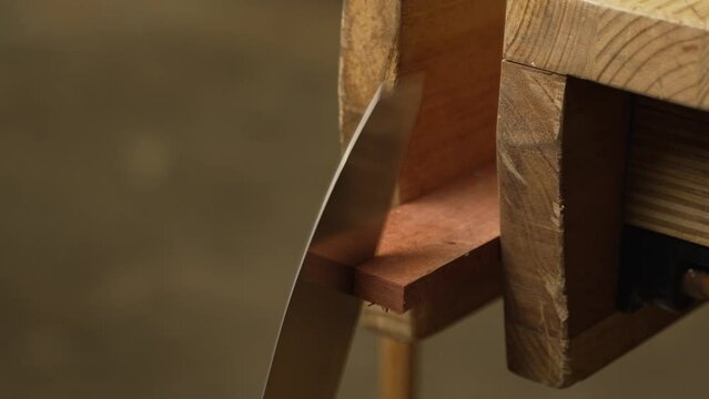 Japanese pull saw making a rip cut through wood