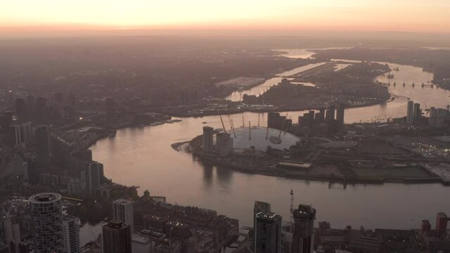 Dolly forward aerial shot towards The O2 Arena London at dawn