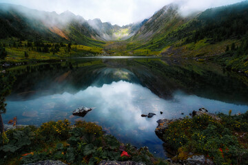 lake in the mountains mountain panorama with dramatic sky