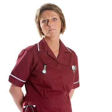 Health Professionals: Compassionate Nurse. A uniformed medical worker with a neutral expression. From a series of related images isolated on white.