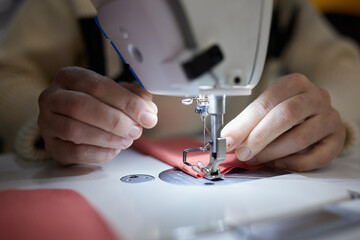 Hands of a woman in the process of sewing on a sewing machine from different angles.