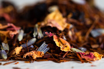 Selective focus macro photography of potpourri flowers and leaves in warm brown and yellow colours