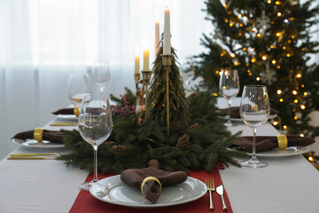 Beautiful table setting with Christmas decor indoors