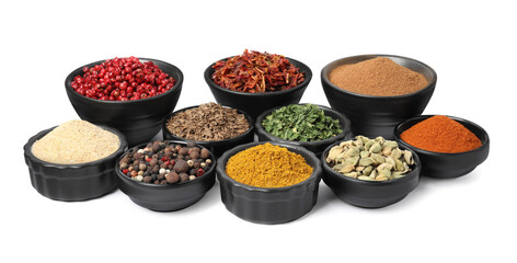 Bowls with different spices on white background