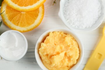 Homemade cosmetic products and fresh ingredients on white wooden table, flat lay