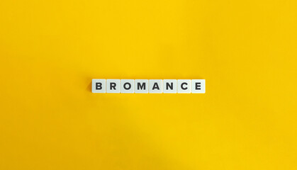 Bromance Word and Concept. Block Letter Tiles on Yellow Background. Minimal Aesthetics.