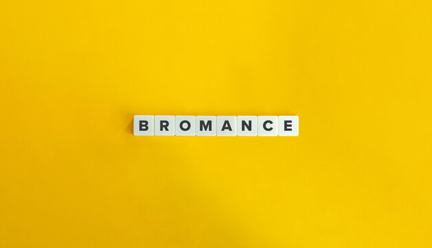 Bromance Word and Concept. Block Letter Tiles on Yellow Background. Minimal Aesthetics.