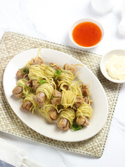 Sosis Ayam Gulung Mie or Chicken Sausage Rolled in Noodles. Cooked by frying and usually served with sauce and mayonnaise. One of the popular street food in Indonesia