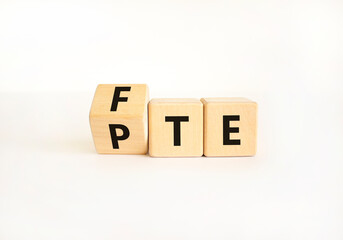 FTE PTE symbol. Concept words FTE full time equivalent PTE part time equivalent. Beautiful white table white background. Business FTE full time equivalent PTE part time equivalent. Copy space.