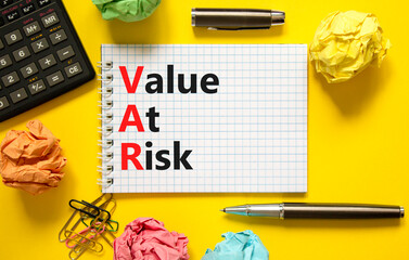 VAR Value at risk symbol. Concept words VAR Value at risk on beautiful white note. Beautiful yellow...