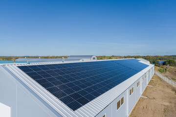 Solar panel on a farm roof. Drone point of view