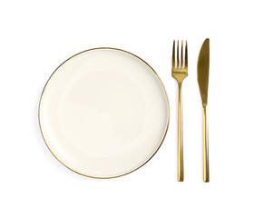 Clean plate and golden cutlery on white background, top view