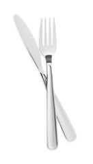 Fork and knife isolated on white, top view. Stylish shiny cutlery set