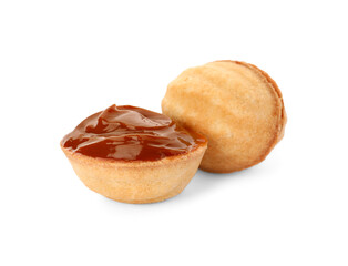 Delicious nut shaped cookies with boiled condensed milk on white background