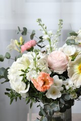 Obraz na płótnie Canvas Bouquet of beautiful flowers on light background, closeup