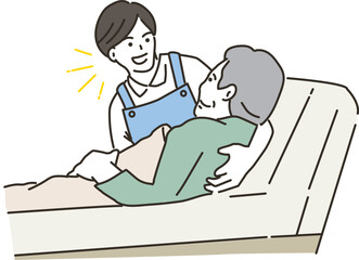 ベッドで起き上がりの介助をする男性介護士
