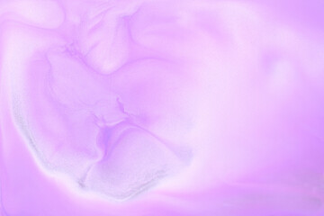 Multicolored creative abstract background. Lilac alcohol ink. Waves, stains, spots and strokes of paint, marble texture