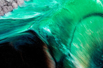 Abstract green color background. Multicolored fluid art. Waves, splashes and blots acrylic alcohol ink, paints under water