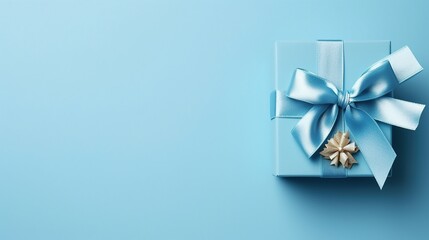 Gift box with  satin ribbon  blue background. Holiday gift with copy space. Birthday or Christmas present, flat lay, top view. Christmas giftbox concept.