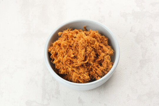 Abon Sapi, dried shredded beef or beef floss, served in bowl.
